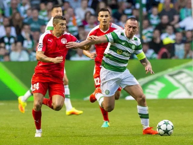 Scott Brown holds off Hapoel Beer Sheva's Maor Mlikson in the 5-2 win over the Israeli champions in Glasgow on Wednesday