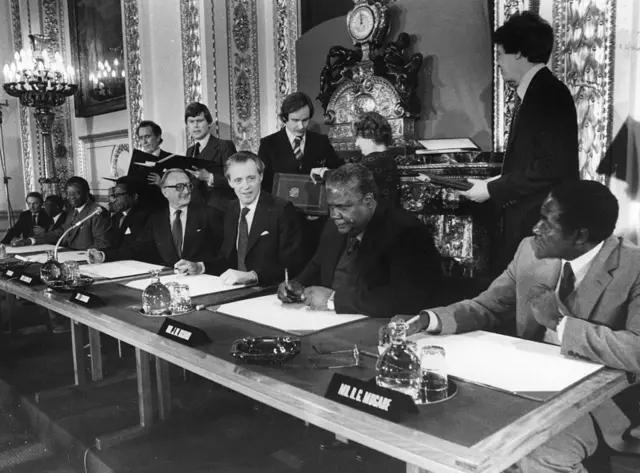 21st December 1979: The leaders of the Patriotic Front, Robert Mugabe and Joshua Nkomo, Lord Carrington the British Foreign Secretary, Sir Ian Gilmore and Bishop Abel Muzorewa the Prime Minister of Zimbabwe-Rhodesia, at Lancaster House. The occasion is the signing of the agreement on the independence of Zimbabwe