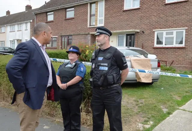 James Cleverly talking to police officers