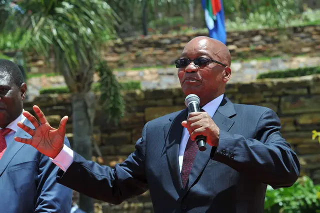 South African President Jacob Zuma speaks after unveiling on December 16, 2013 a 9-meter bronze statue of South African former president Nelson Mandela on the lawns of the Union Buildings, the seat of government in Pretoria where Mandela was inaugurated as South Africa's first black president in 1994.