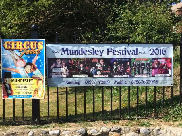 A poster for Mundesley Festival, on railings