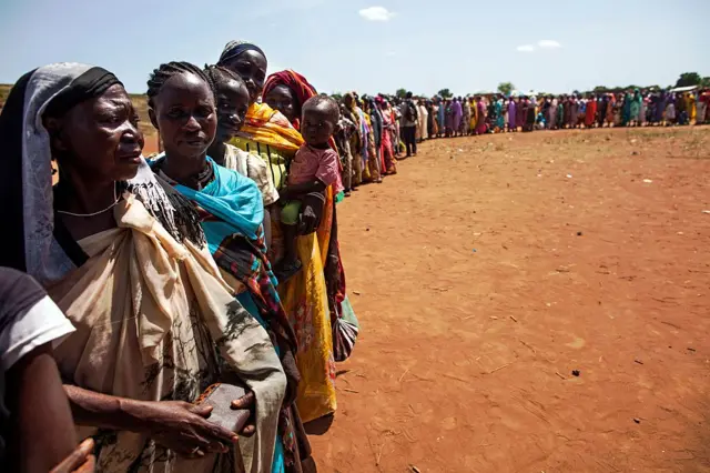 Queue of displaced people