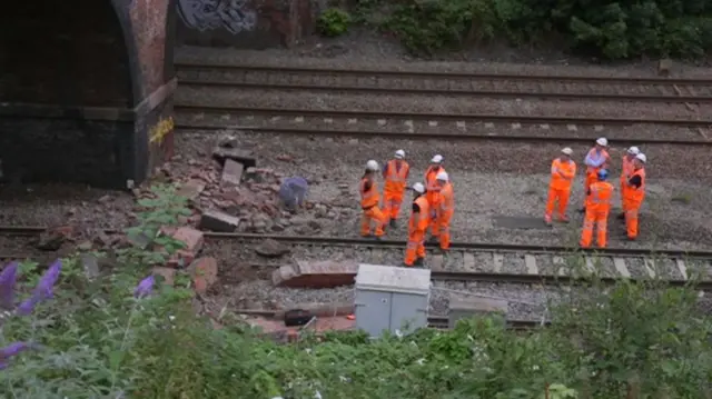 Engineers examine the bridge