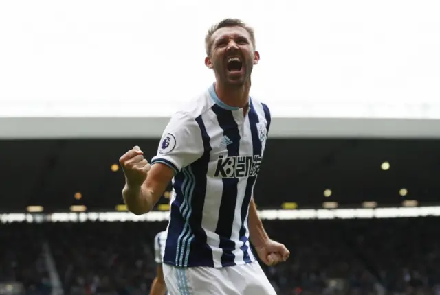 Gareth McAuley celebrates