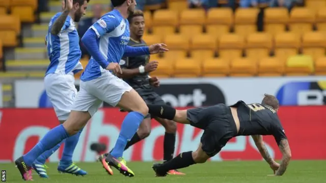 Leigh Griffiths goes down in the St Johnstone box, but was booked for diving