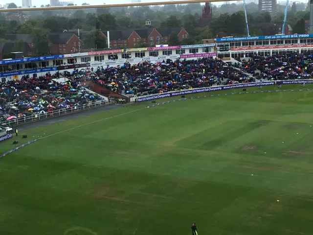 Umbrellas up at Edgbaston