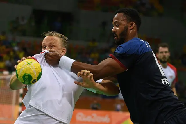 Denmark's Casper Mortensen vies with France's Timothey N'Guessa in the Rio preliminaries