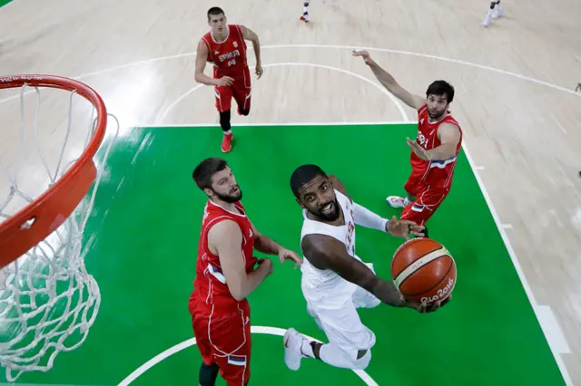 Kyrie Irving of United States goes to the basket against Stefan Markovic