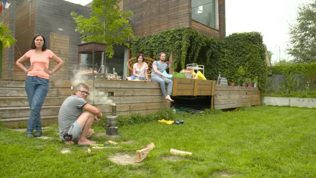 people hanging out outside a dacha