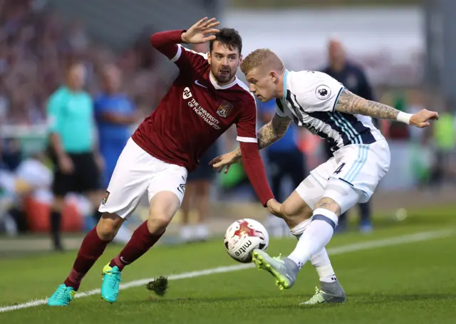 Brendan Moloney of Northampton Town in action with James McClean of West Brom