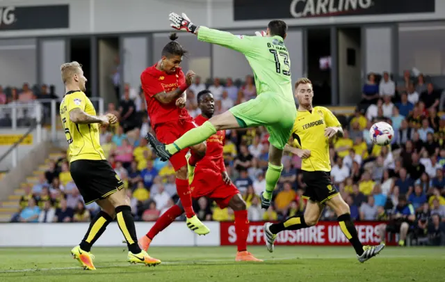 Liverpool's Roberto Firmino scores their second goal