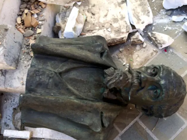 A bust is seen on the ground following an earthquake in Accumoli di Rieti, central Italy