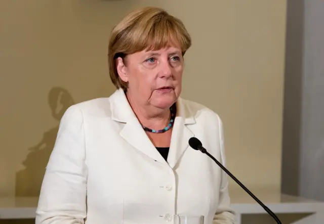 Angela Merkel speaks to the media from Estonia on Wednesday