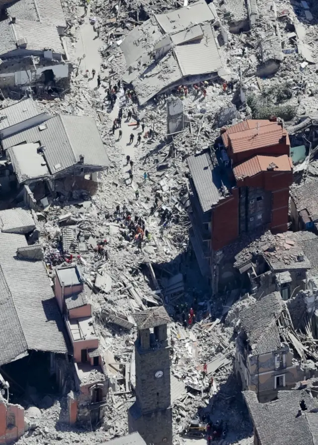 Rescuers search amid rubble in Amatrice