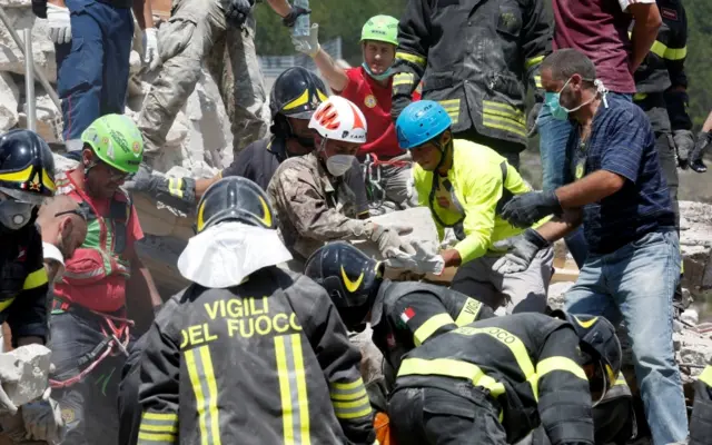 Rescuers at work in Pescara del Tronto