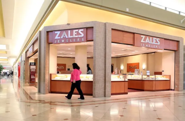 A shopper walks by a Zales Jewelers store at the Serramonte Mall in Daly City, California.