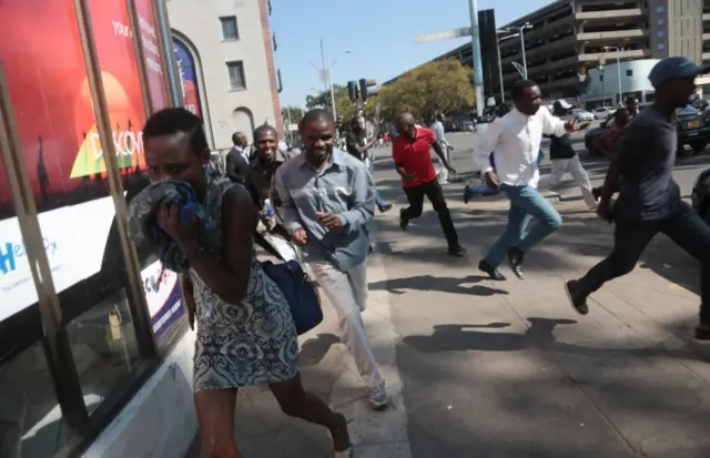 Protesters fleeing from police