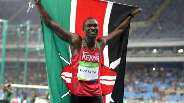 David Rudisha wrapped in the Kenyan flag