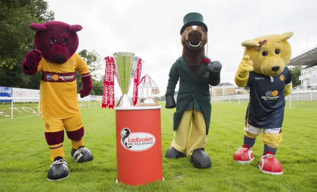 Motherwell mascots Claret and Amber join the Hamilton Racecourse mascot Duke ahead of tomorrow's Mascot Race