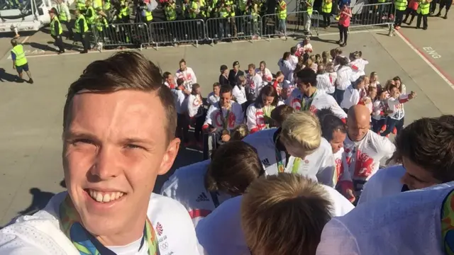 Joe Clarke's selfie on steps of returning flight at Heathrow