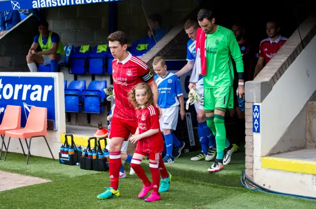 Ryan Jack leads out the Aberdeen team