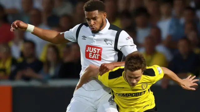 Derby County's Cyrus Christie battles with Burton Albion's Will Miller