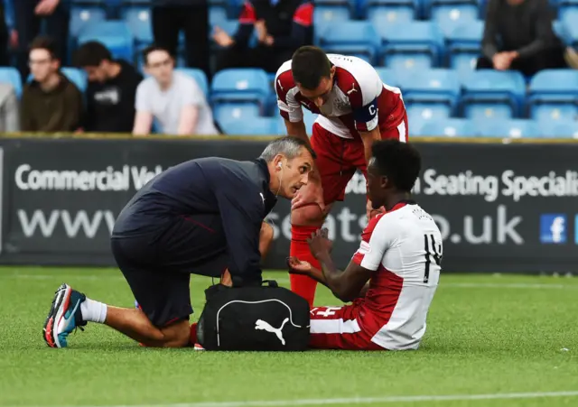 Joe Dodoo receives treatment