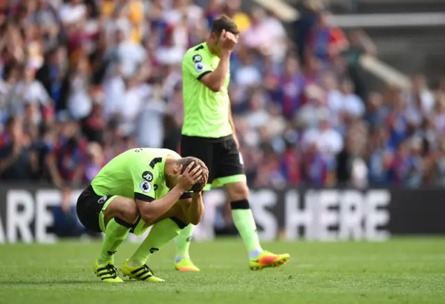 Bournemouth players dejected after conceding their late goal