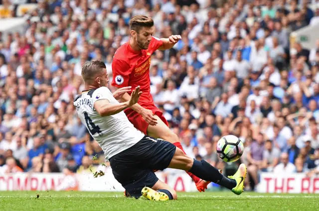 Toby Alderweireld tackles Adam Lallana