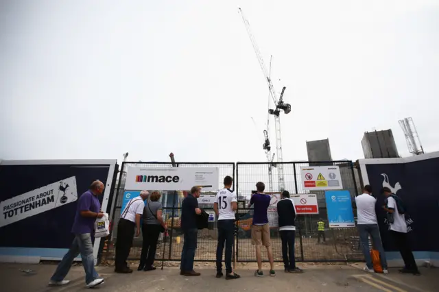 Tottenham fans look at the building of the new stadium