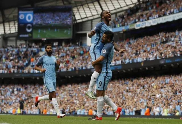 Raheem Sterling celebrates his goal with teammate Sergio Aguero