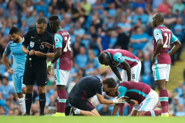 West Ham's Reid is treated by medics