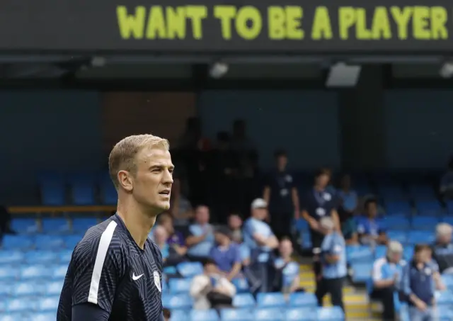 Joe Hart warms up