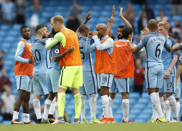 Manchester City players celebrate victory over West Ham