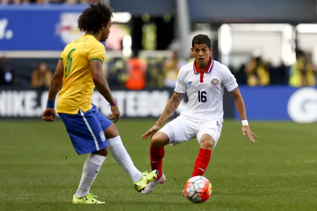 Cristian Gamboa keeps a close eye on Brazil's Marcelo while playing for Costa Rica at the Red Bull Arena in New Jersey last year