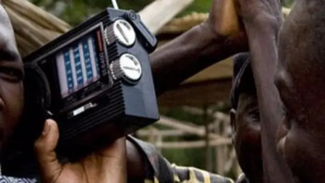 Men listening a radio