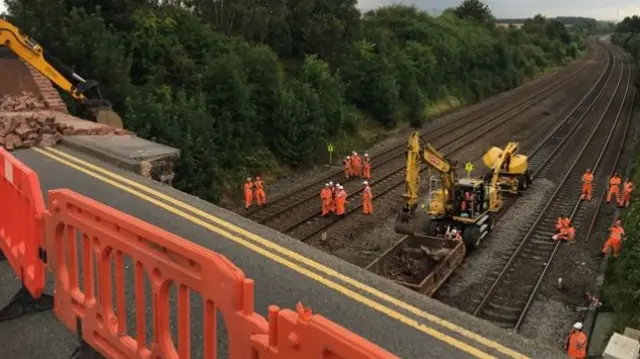 Reapirs to the rail line after the bridge collapse