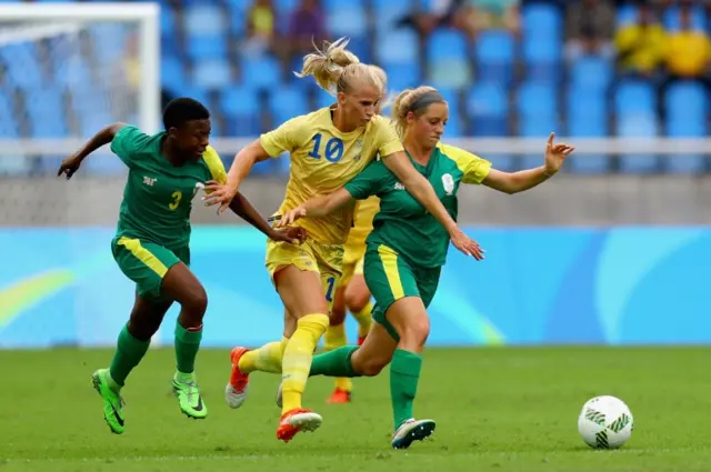 Sofia Jakobsson of Sweden (C) battles Stephanie Malherbe (R) and Nothando Vilakazi of South Africa during the Women"s Group E first round match between Sweden and South Africa during the Rio 2016 Olympic Games at the Olympic Stadium on August 3, 2016 in Rio de Janeiro, Brazil.