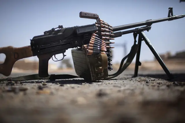 M249 light machine gun used by Libyan rebels in the Western front line town of Gualish is seen at the entrance of the deserted town July 12, 2011