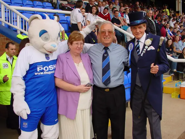 Derek Poole and his wife Margaret with the Peterborough United mascot and Mr Posh