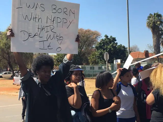 Protester outside the school