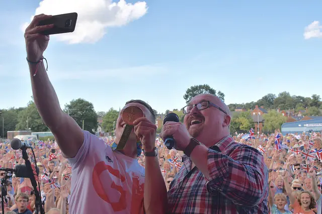 Joe on stage taking a selfie