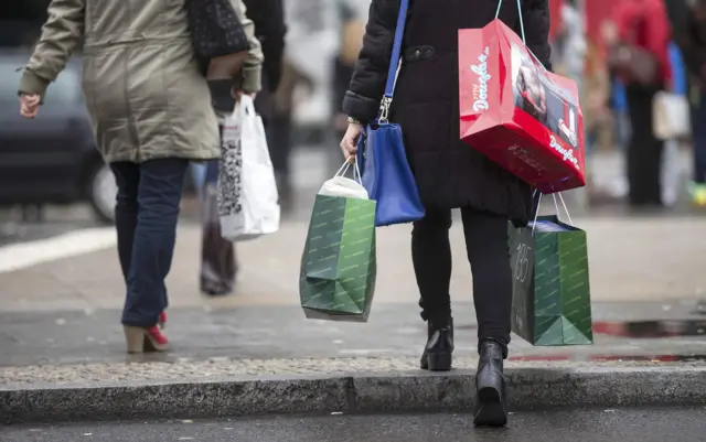 Poeple carrying shopping bags