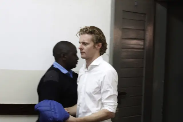 Jack Alexander Wolf Marrian arrives in Kibera Law Court in Nairobi, Kenya Thursday, Aug. 4, 201