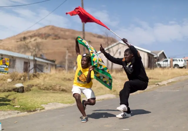 frican National Congress ( ANC) and South African Communist Party ( SACP) supporters dance and sing in celebration at Wembezi township near Estcourt some 215 kilometres west of Durban on August 3, 2016