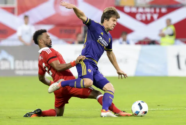 Aberdeen's right-back Shay Logan tackles Maribor's Damjan Bohar.