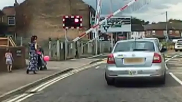 Car on level crossing