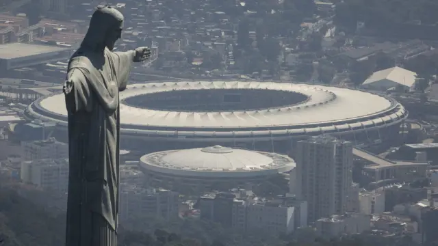 The Christ the Redeemer statue stands above Maracana stadium in Rio de Janeiro, Brazil