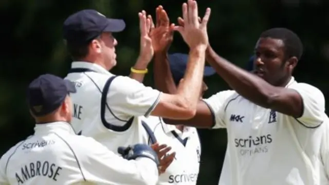 Warwickshire players high five