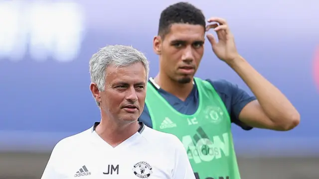 Manchester United manager Jose Mourinho (left) and defender Chris Smalling